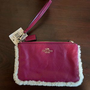 COACH wristlet with faux fur detail (pink)